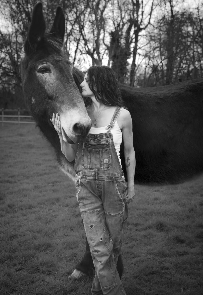 Portrait of urban farmer and her mule Willie