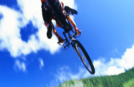 mountain bike rider flying high for Jansport Outdoor Equipment